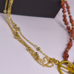 Roku darināta kaklarota „Zelta ausma“