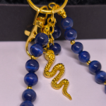 Roku darbs somas un atslēgu piekariņš „Nakts čūska“