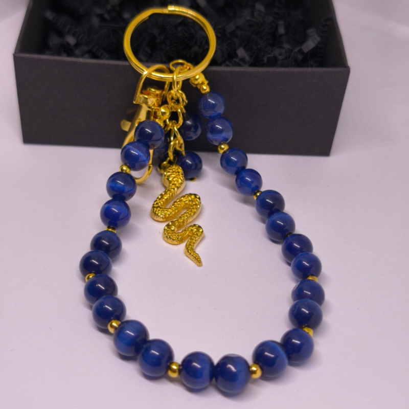 Roku darbs somas un atslēgu piekariņš „Nakts čūska“